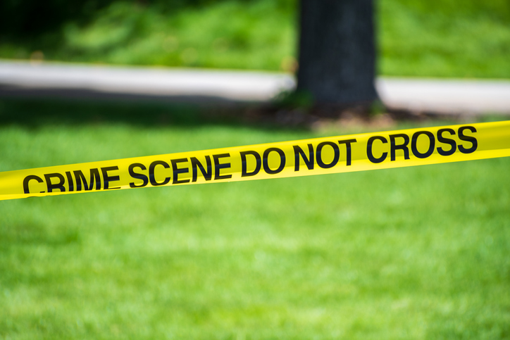 Crime Scene Tape in Public Park Area
